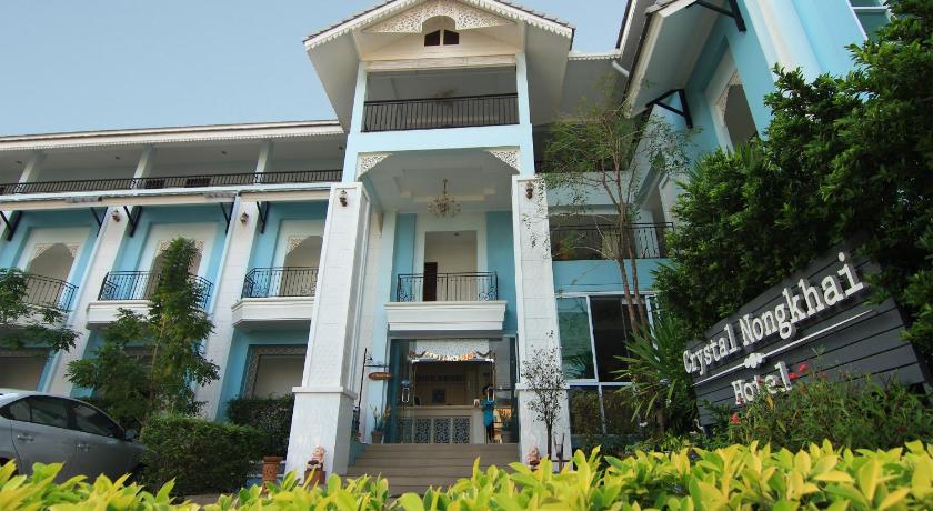 a large building with a clock on the front of it, Crystal Palace Hotel Nongkhai in Nong Khai