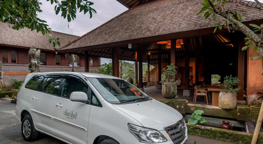 a white truck parked in front of a house, Ulun Ubud Resort in Bali