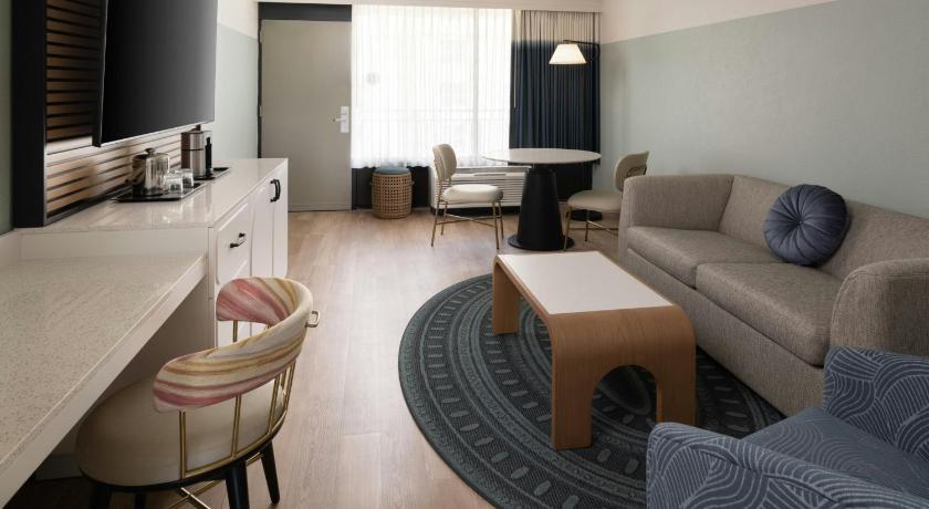 Image of One-Bedroom King Suite with Sofa Bed and Pool View - Mobility Accessible with Roll-In Shower 3
