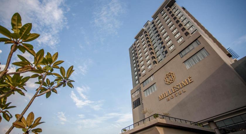 a large building with a clock on the top of it, Millesime Hotel Johor Bahru in Johor Bahru