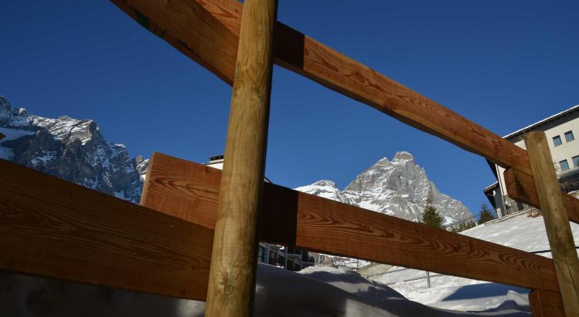 a fence that has some snow on top of it, Il Cuore Del Cervino in Valtournenche