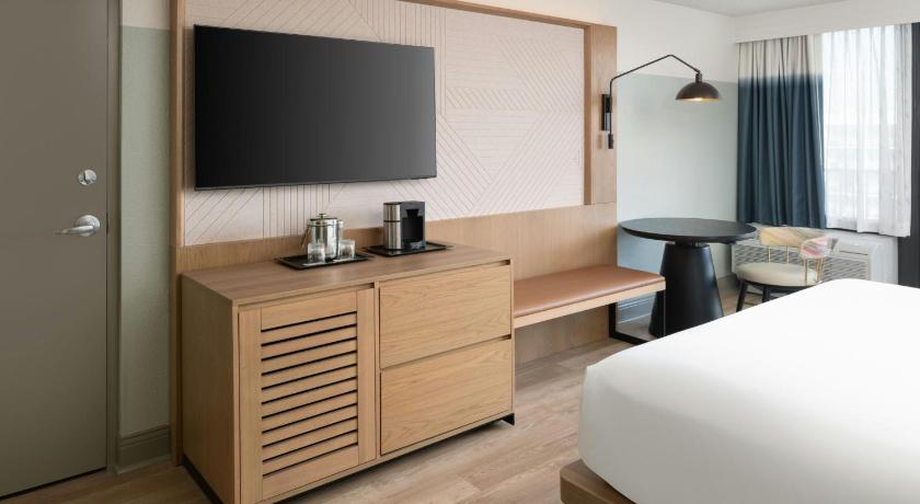 Image of One-Bedroom King Suite with Sofa Bed and Pool View - Mobility Accessible with Roll-In Shower 6