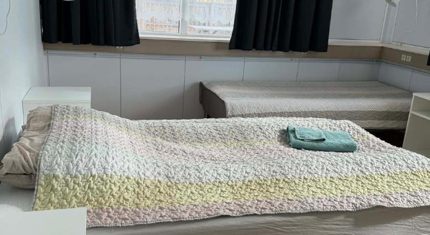 Image of Basic Triple Room with Shared Bathroom 1