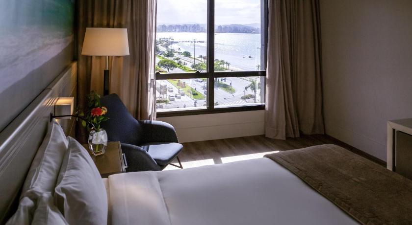 Image of Superior room with 1 king size bed and 1 sofa bed, with partial seaview 3