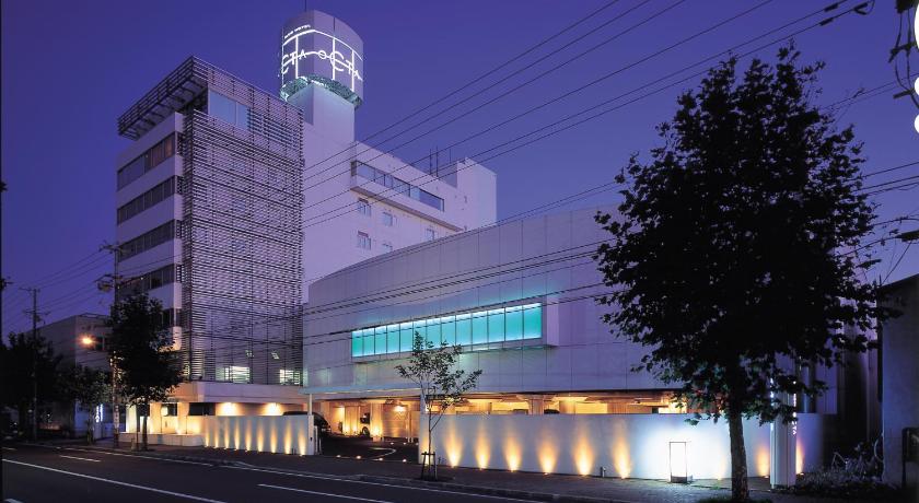 a large building with a clock on the side of it, Blue Hotel Octa - Adults Only in Sapporo