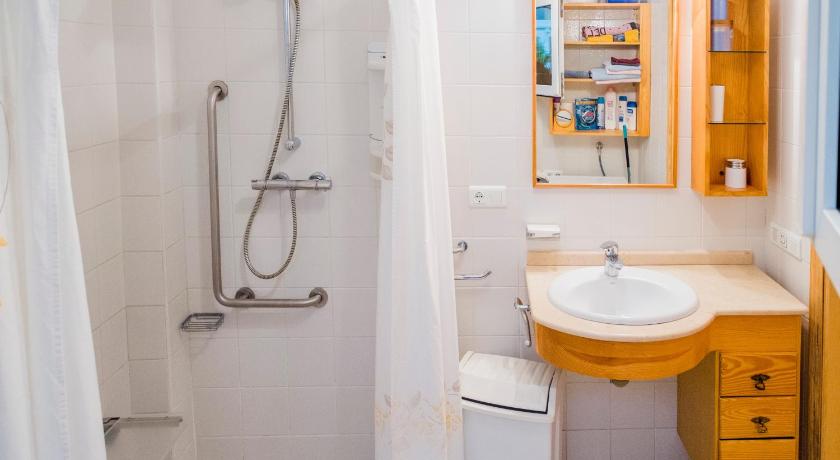 a bathroom with a sink, toilet and shower, Casa Charlotte in Nerja