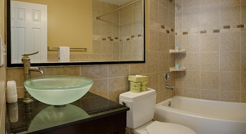 a bathroom with a sink, toilet and bathtub, South Beach Apartment in Ocean City (MD)