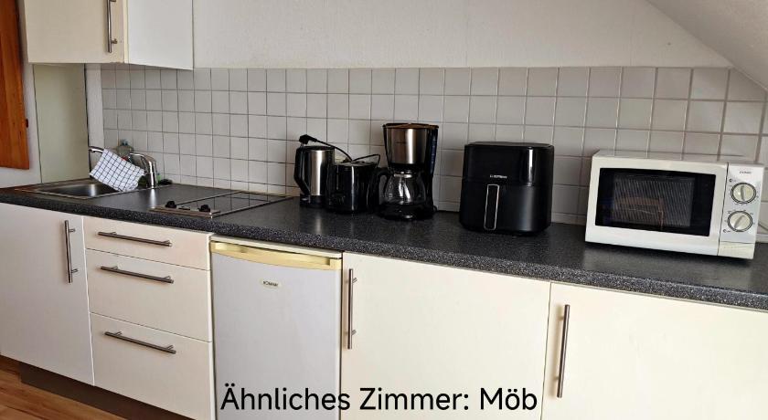 Image of Twin Room with Shared Bathroom and Kitchenette 11