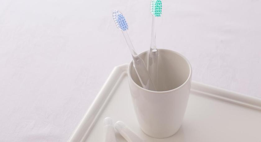 a cup with a toothbrush and toothpaste in it, Ark Hotel Osaka Shinsaibashi in Osaka