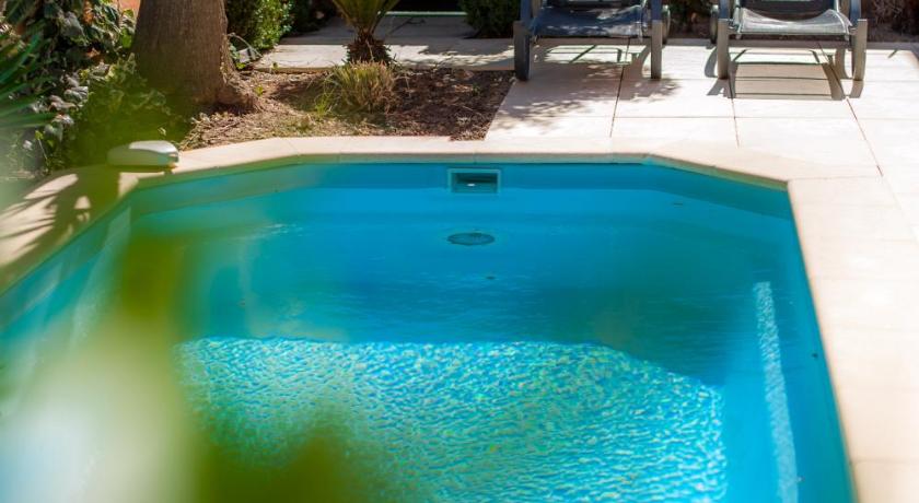 a pool with a pool table in the middle of it, Riads Resort by Nateve - Couples Only in Agde