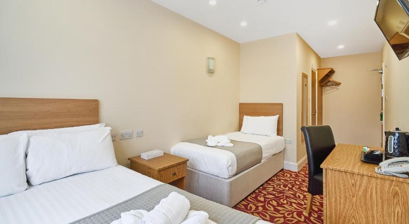 Image of Standard Room with One Double Bed and One Single Bed - Non-Smoking 0