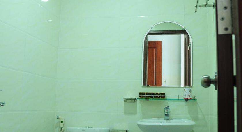 a bathroom with a toilet and a sink, Gia Huy Guesthouse in Da Nang