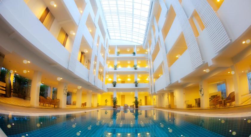 a large swimming pool in a large room, Trang Hotel Bangkok (SHA Plus+) in Bangkok