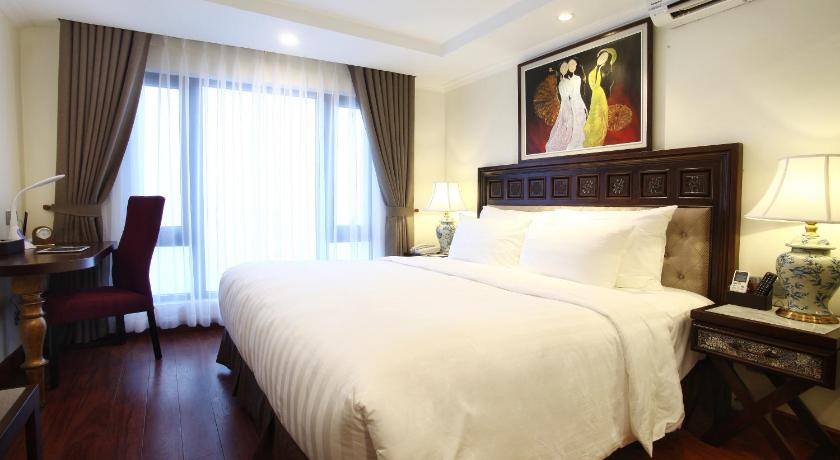 a hotel room with a large bed and a large window, Paris Boutique Hotel Sapa in Sapa