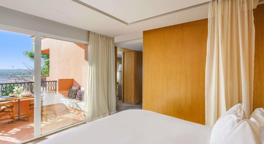 Image of Contemporary Deluxe Room with Balcony and Pool View 0