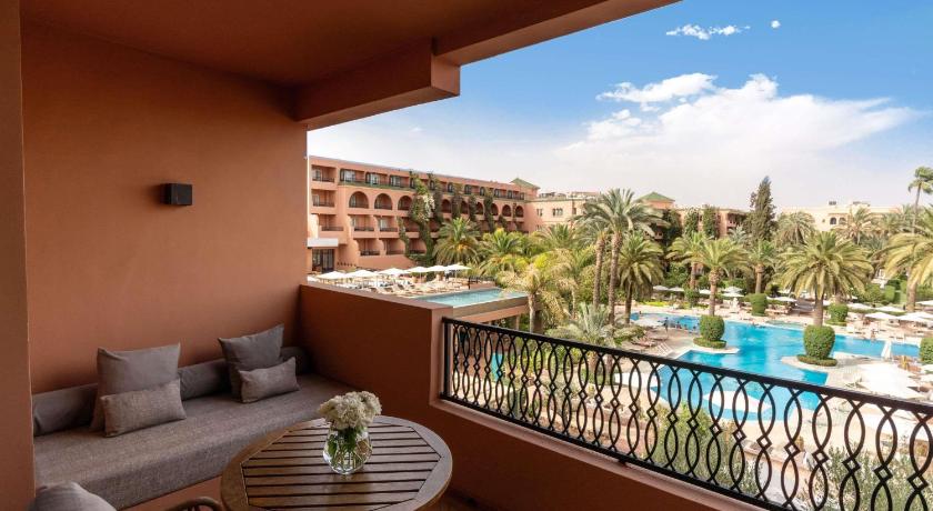 Image of Contemporary Deluxe Room with Balcony and Pool View 1
