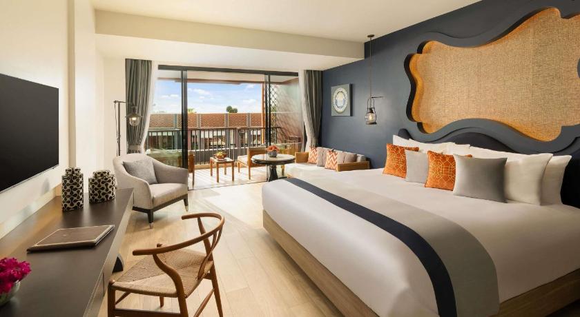 Image of Deluxe Room Pool View 1 King Bed Balcony 0