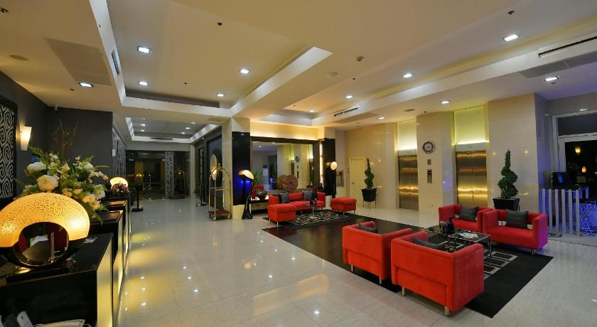 a living room filled with lots of furniture, Paseo Premiere Hotel by Cocotel Powered by ASTON in Laguna