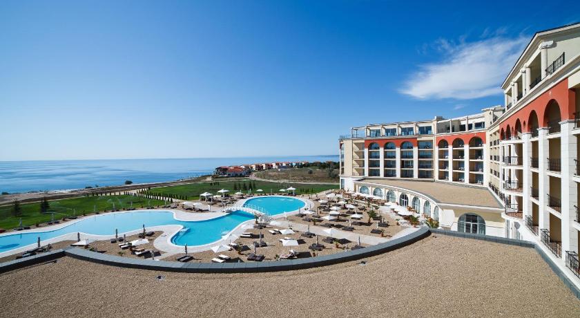 a beach with a pool and a large building, Lighthouse Golf & Spa Hotel in Balchik