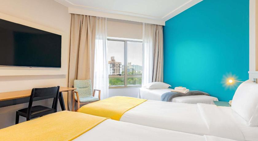 Image of Executive apartment with two single beds upper floor modern design 1