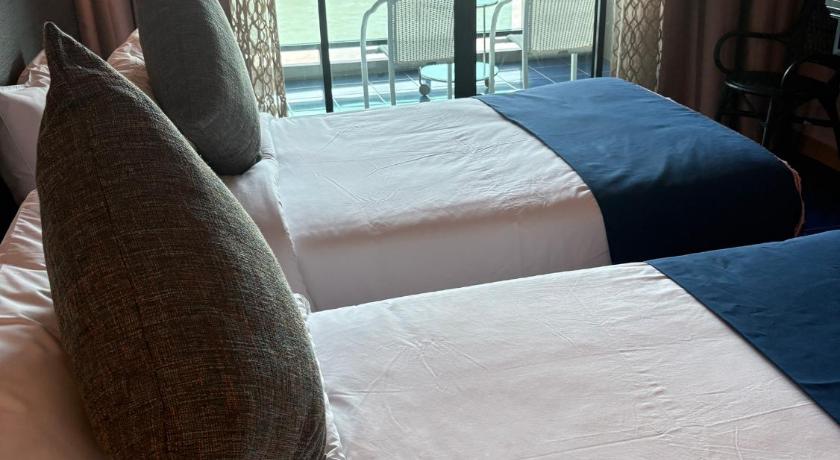 Image of Deluxe River View Twin Room with Balcony 8