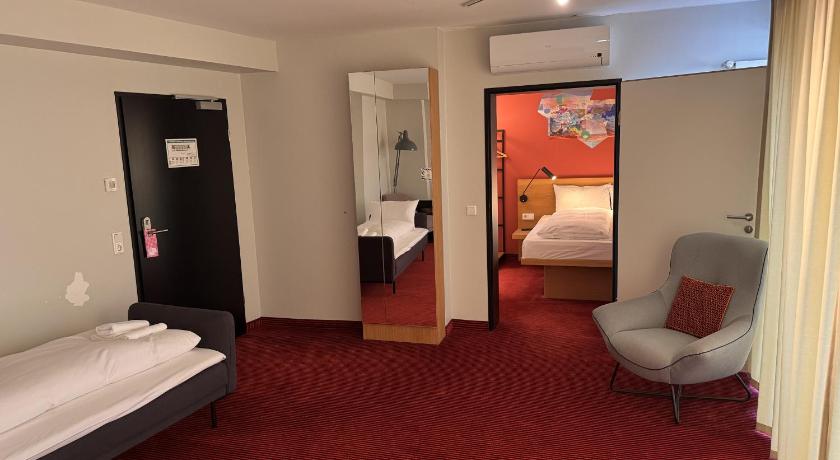 Image of Premium Suite with 1 double bed, 1 single bed a nd 1 sofa bed with a large terrace 4