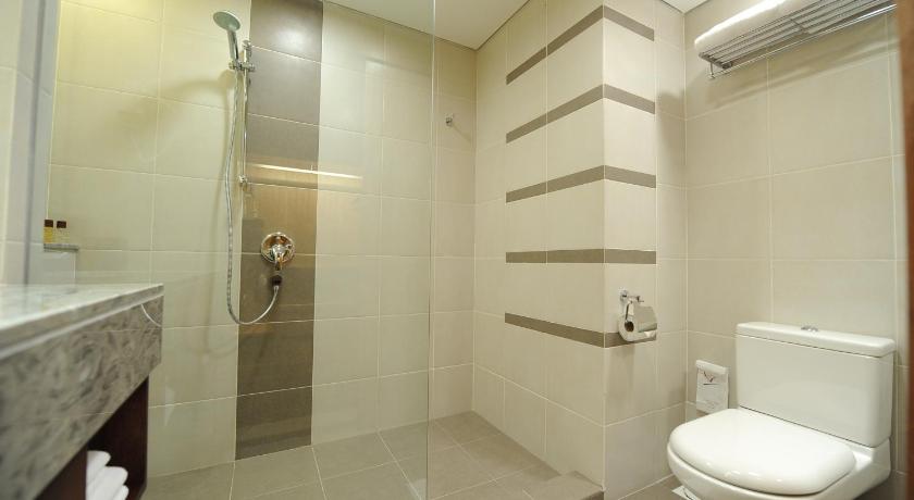a bathroom with a toilet, sink, and shower, Concorde Hotel Kuala Lumpur in Kuala Lumpur
