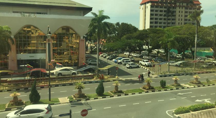 a city street filled with lots of tall buildings, Premierz Hotel in Labuan