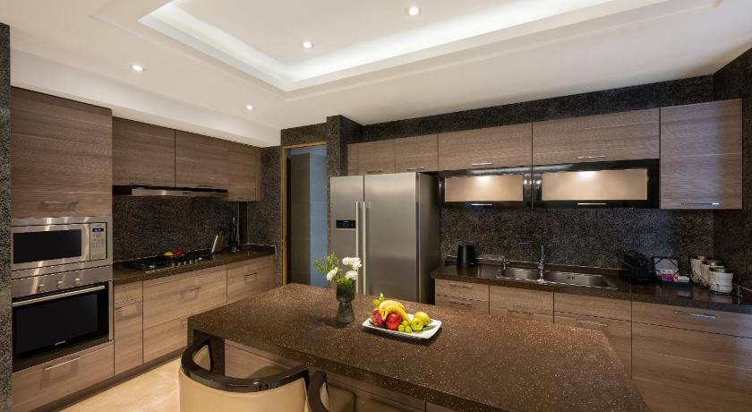 Image of Three-Bedroom Suite with Dining Area and Kitchen 1
