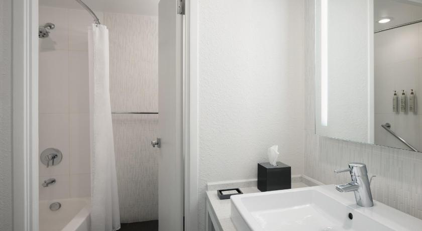 Image of TOWER - Two Queen Beds + Sleeper Chair, Roll-in Shower 0