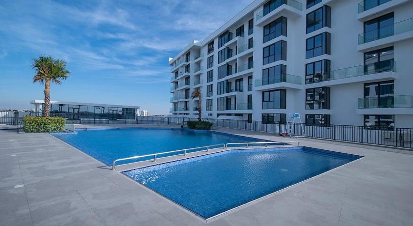 Foto de Stunning 2BR Sea View in Blue Bay Walk - Reserva com desconto Agoda