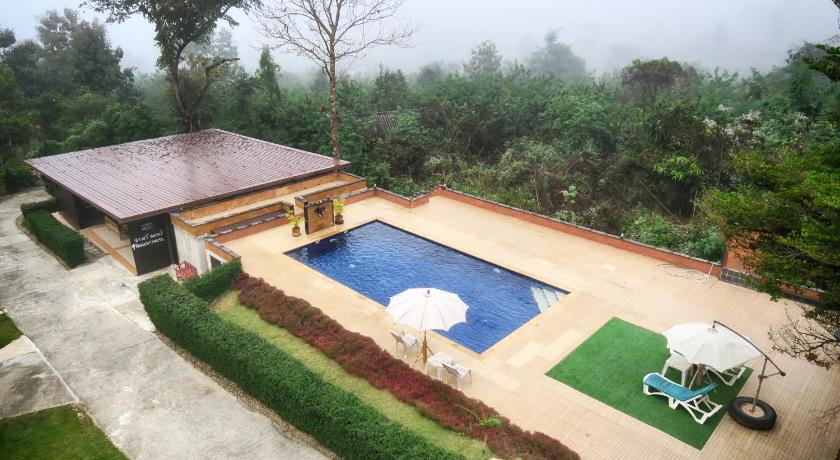 a backyard with a pool and a lawn chair, Pai Happyvillage in Pai