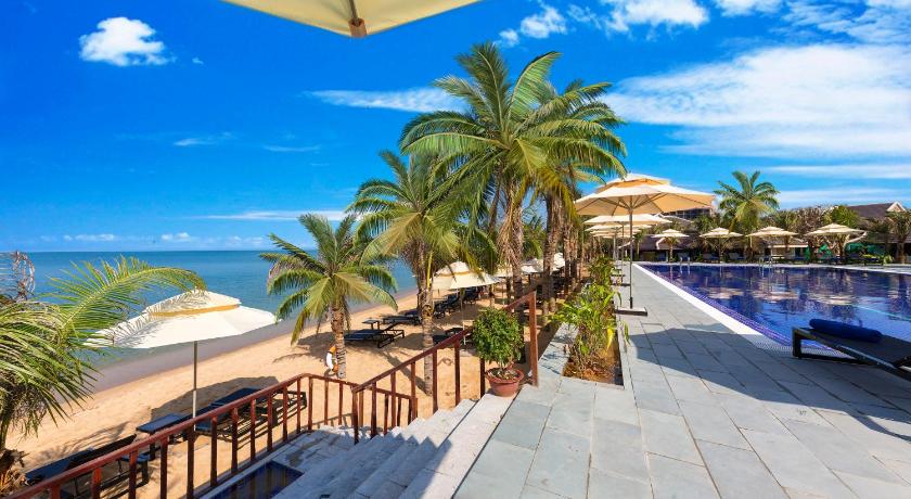 a beach with palm trees and palm trees, Amarin Resort in Phu Quoc Island