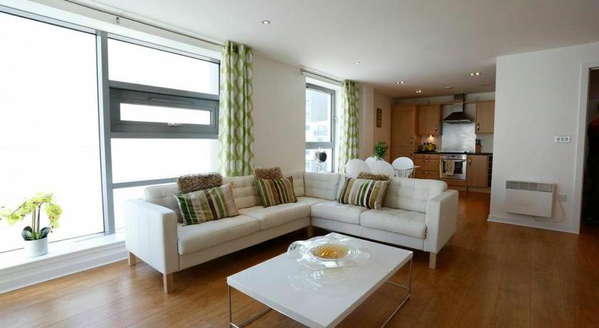a living room filled with furniture and a window, Edinburgh Waterfront Apartments in Edinburgh