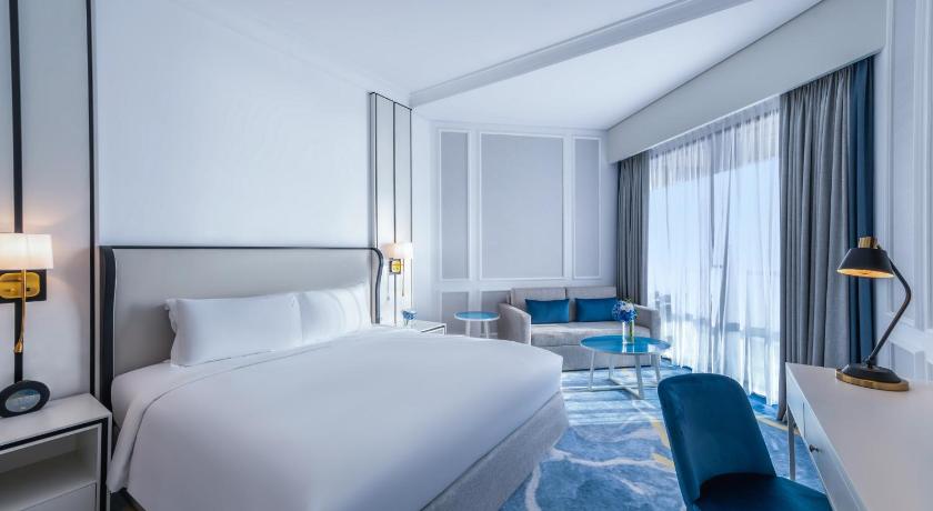Image of Family room - Two interconnecting rooms with Balcony, Partial Seaview, 1 King Bed, 2 Single Beds 0