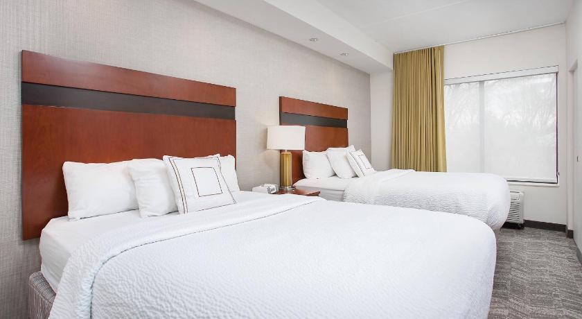 Image of Suite, 2 Queen Beds, Trundle Sofa, Hearing Accessible, Mobility Accessible with Roll-In Shower 0