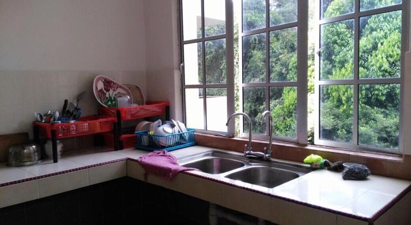 a kitchen with a sink and a window, SA Apartments @ Crown Imperial Court in Cameron Highlands