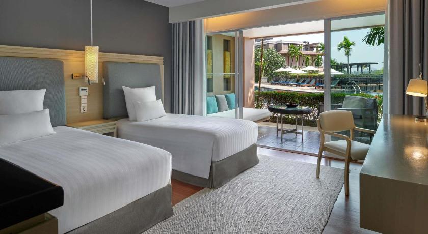 Image of Deluxe Room, 2 single size beds, balcony and garden view 0
