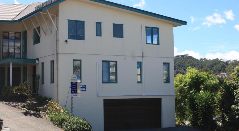 a large white house with a large window, Parkhill Accommodation in Whangarei
