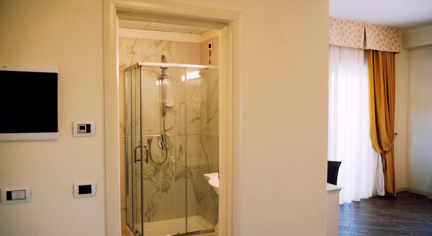 a bathroom with a shower and a window, Hotel Colaiaco in Anagni