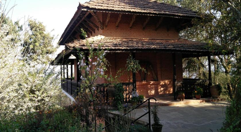a large white house with a large window, The Fort Resort- Nagarkot in Nagarkot