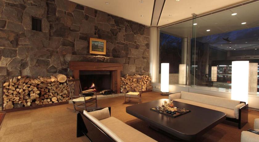 a living room filled with furniture and a fireplace, Minakami Kogen Hotel 200 in Minakami