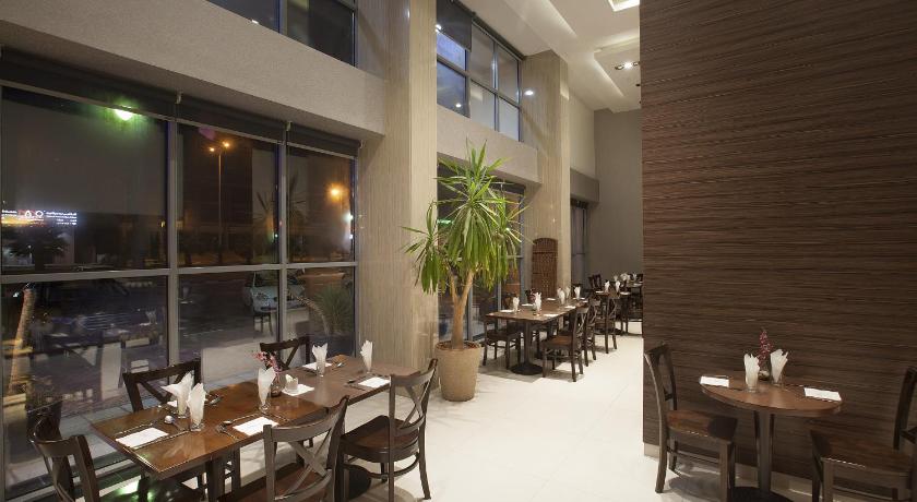 a dining room filled with tables and chairs, Hyata Watheer Hotel & Suites in Dammam