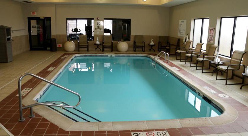 a swimming pool with a pool table and chairs, Best Western Plus Omaha Airport Inn in Carter Lake (IA)