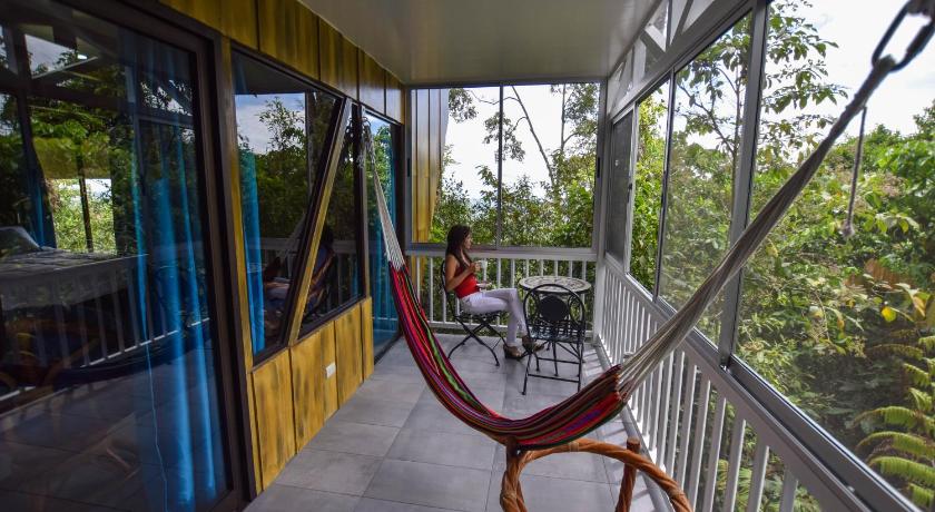 a boat is tied to a railing on a deck, Arenal Waterfall Lodge Villas in La Fortuna