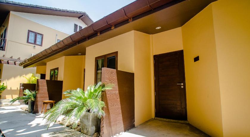a building with a door open and a patio area, Lilu Hotel Pai (SHA Plus+) in Pai