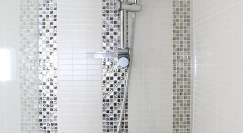 a shower stall with a glass shower door, Charoen Hotel (SHA Extra Plus) in Udon Thani