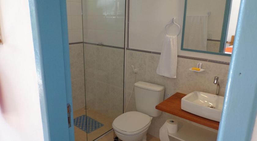 a bathroom with a toilet, sink, and shower, Prima Graca in Buzios