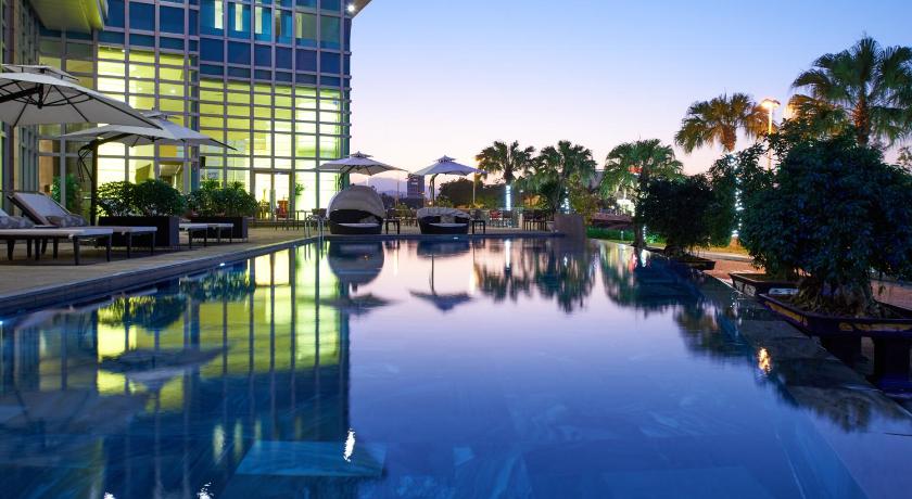 a large swimming pool in front of a large building, Grand Mercure Danang in Da Nang