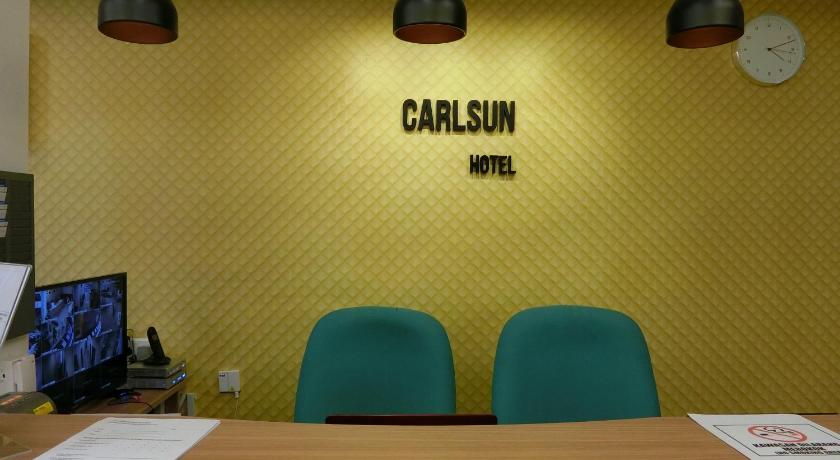 a room with a table and chairs and a lamp, Carlsun Hotel in Johor Bahru